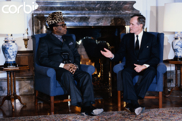 24 Feb 1989, Japan --- American President George Bush speaks with Zairean President Mobutu Sese Seko while in Japan. --- Image by © Wally McNamee/CORBIS