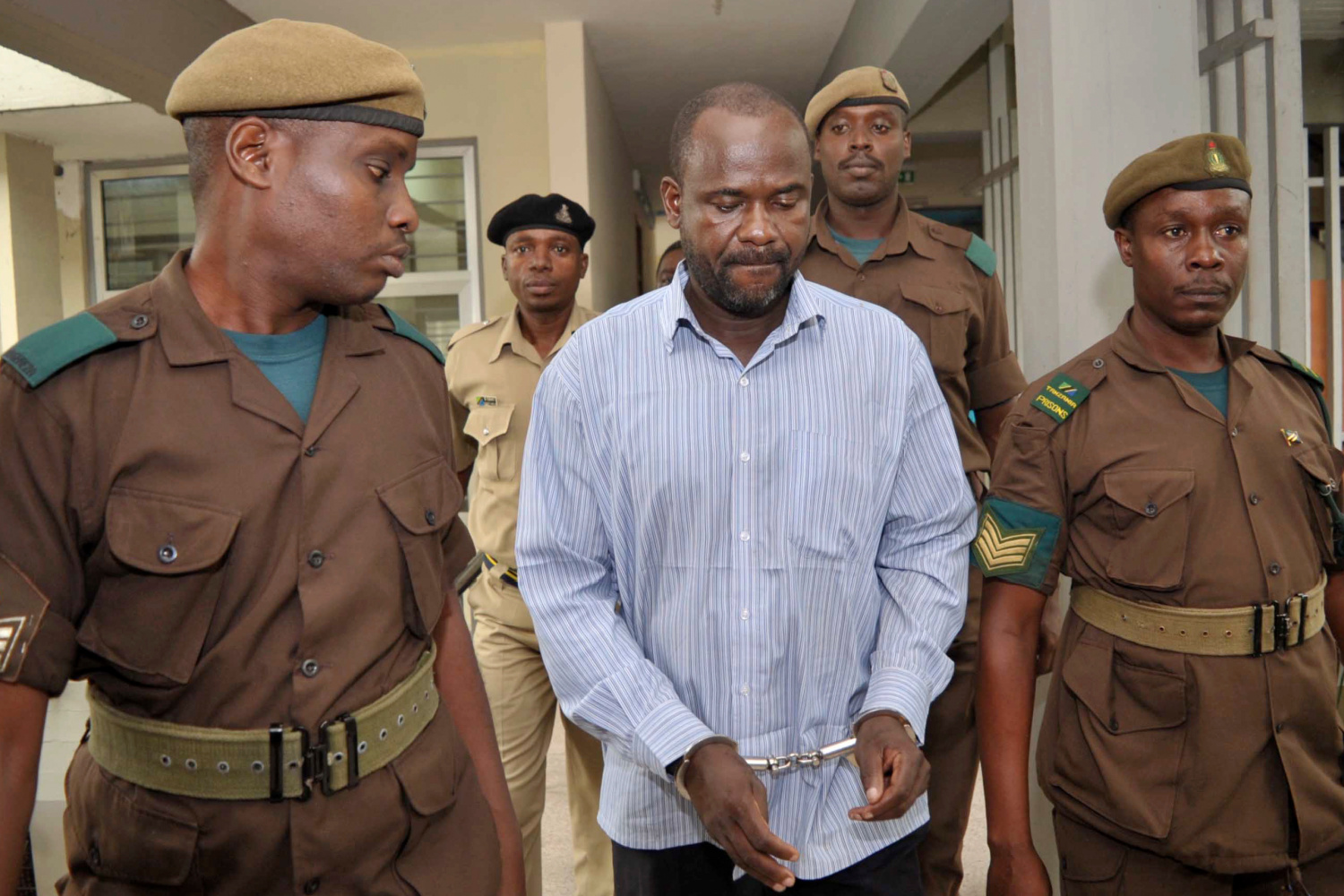ADF leader Jamil Mukulu, center, appears at a magistrates court to challenge extradition proceedings against him, in Dar es Salaam, Tanzania, May 22, 2015