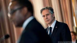 Antony Blinken listens to his Rwandan colleague Vincent Biruta at a joint press conference